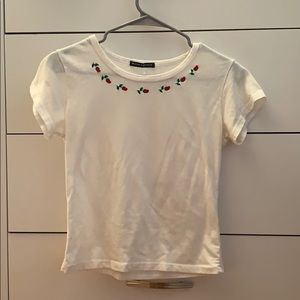Brandy Melville white baby tee with roses